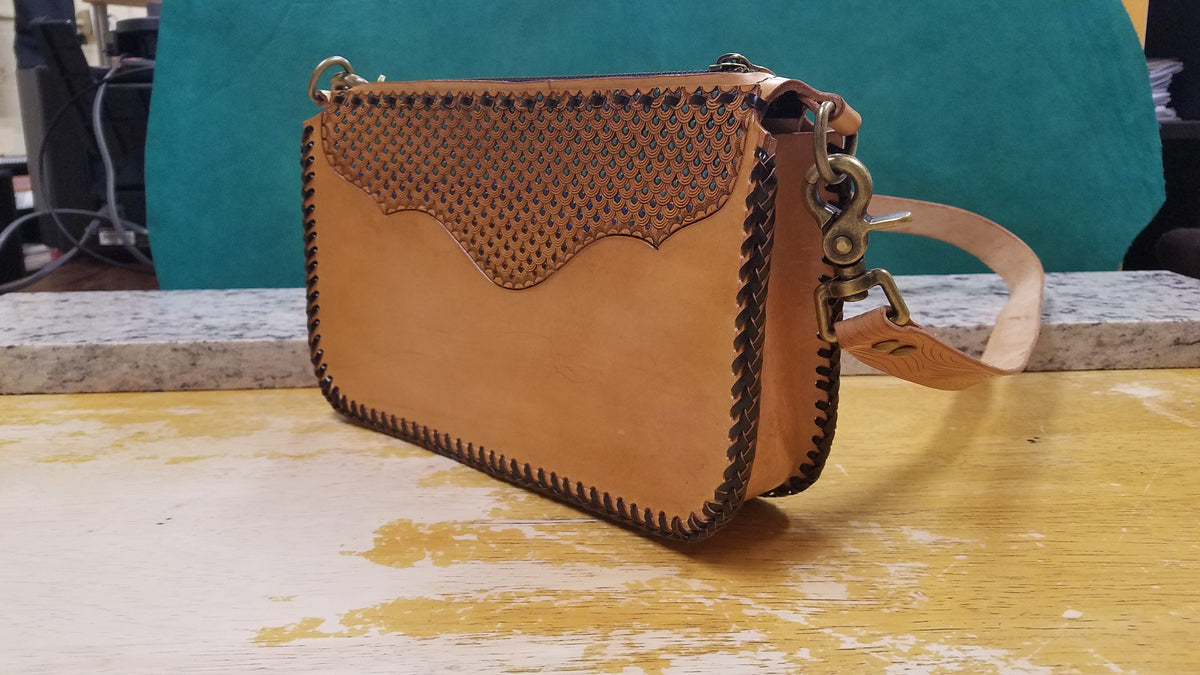 Purse with turquoise flowers and leather braiding