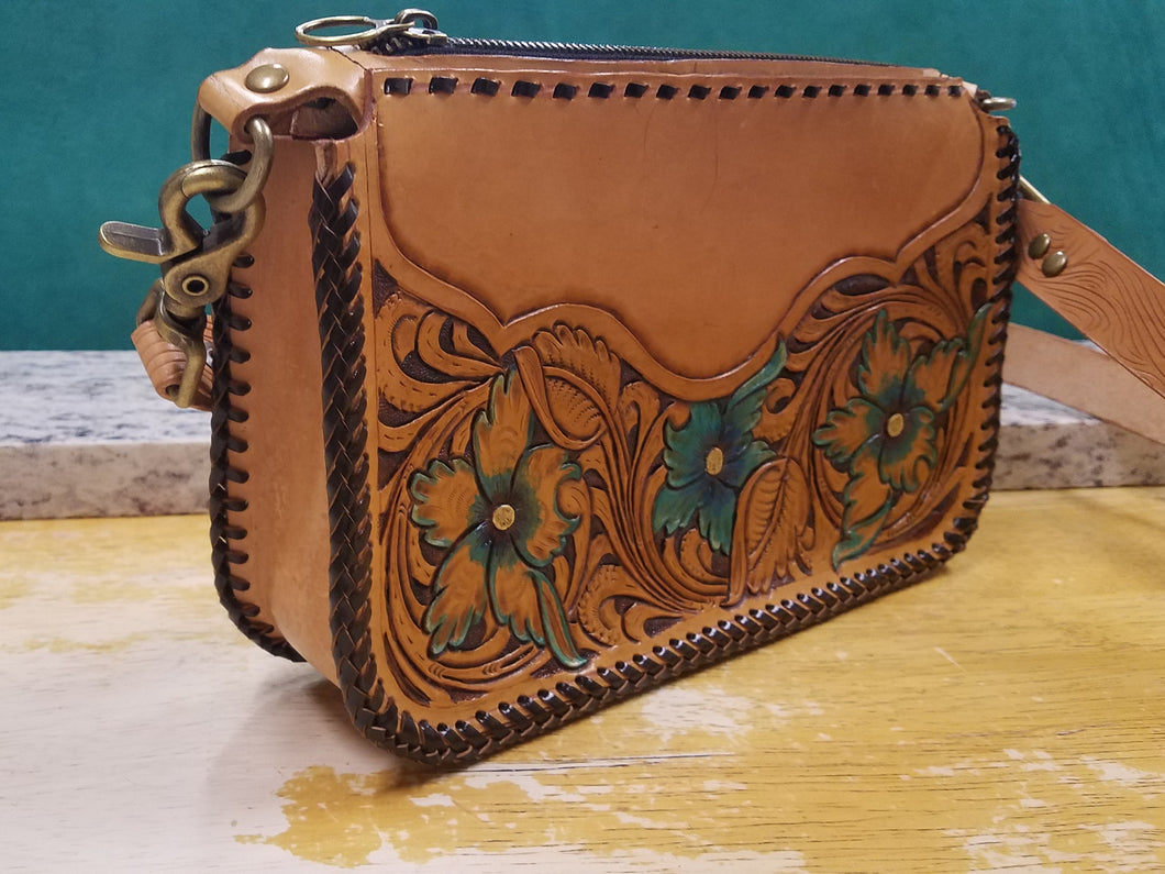 Purse with turquoise flowers and leather braiding