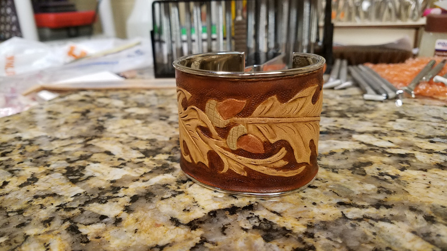 Leather cuff with acorns