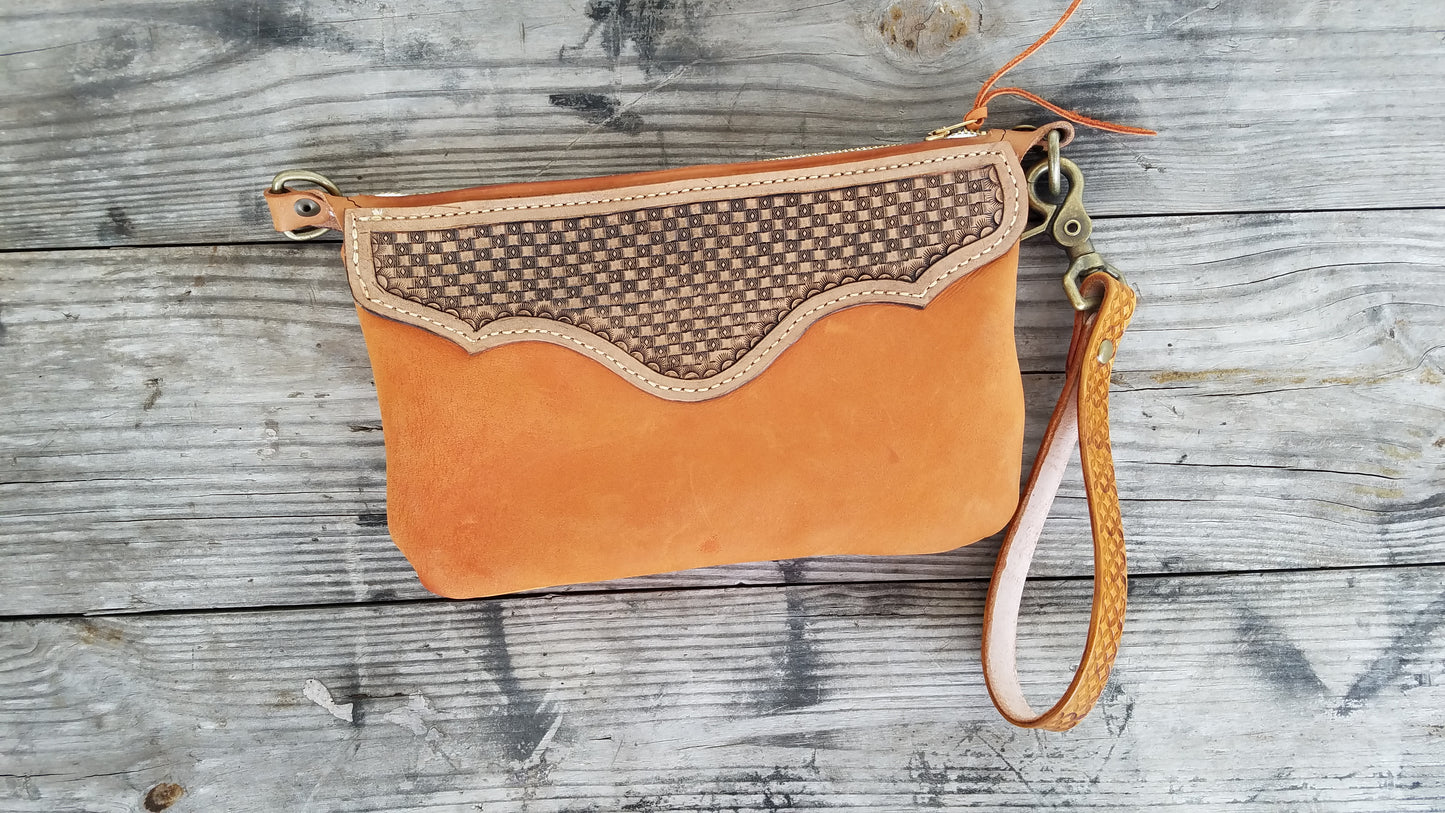 Hand tooled leather wristlet with orange chap leather body